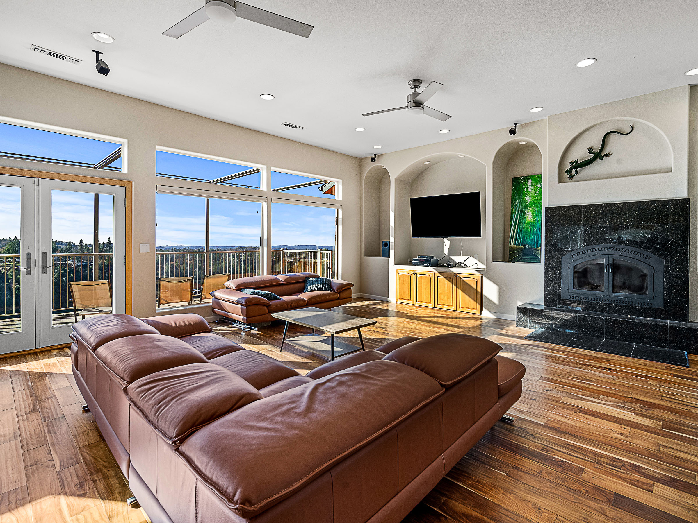 Sunlit family room opening to the deck and canyon view